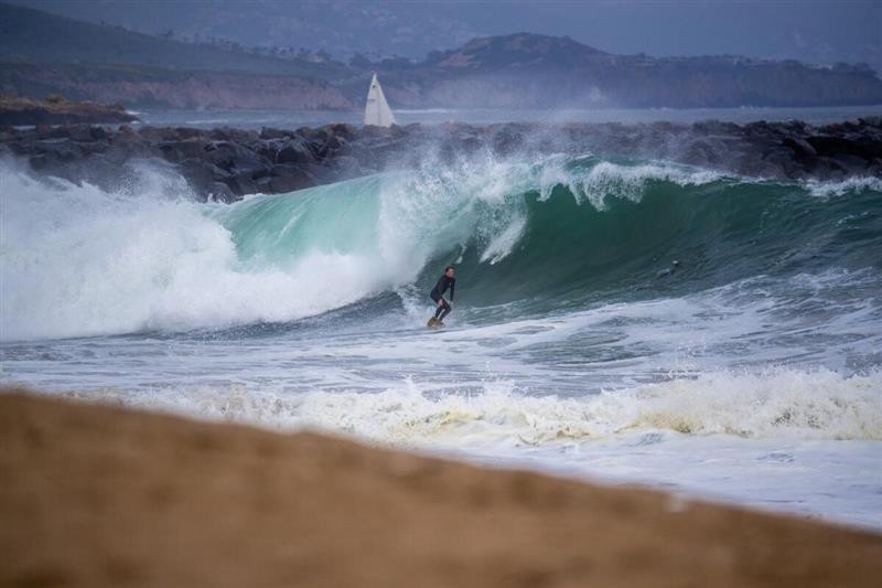 A surfer rides a big wave at the Wedge in Newport Beach. The city is planning to make the nearby beach more accessible. (Allen J. Schaben / Los Angeles Times)
